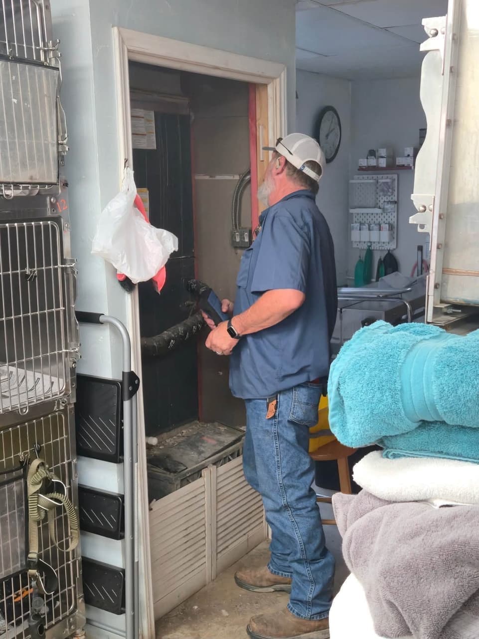Higher Standard Air Services technician performing HVAC repair at Special Pals shelter